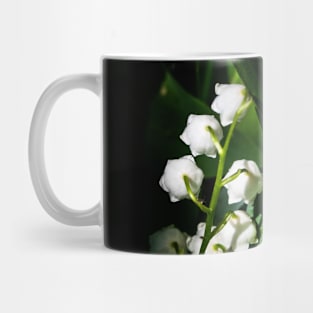 Flowers cradled in the leaves of green. Mug